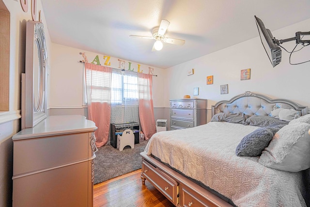 bedroom with hardwood / wood-style flooring and ceiling fan