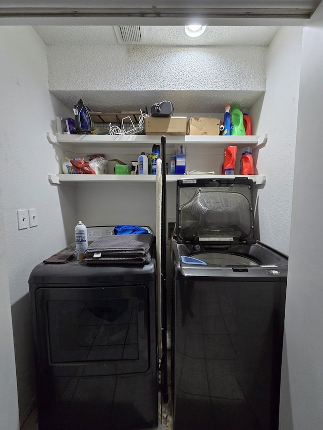 laundry room with separate washer and dryer