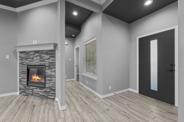 8514 Santa Isabella, Odessa, TX 79765 - foyer entrance with a tile fireplace, wood finished floors, baseboards, and recessed lighting