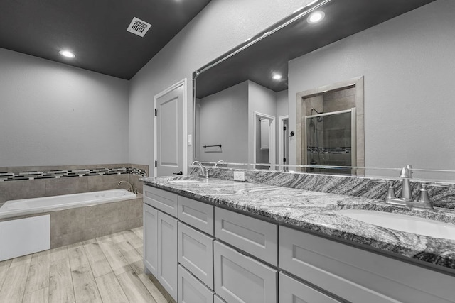 8514 Santa Isabella, Odessa, TX 79765 - bathroom with a sink, double vanity, a shower stall, and visible vents