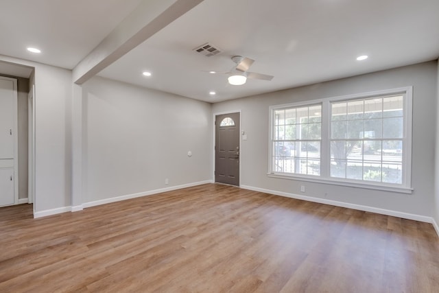 entryway featuring beam ceiling, light hardwood / wood-style flooring, and ceiling fan