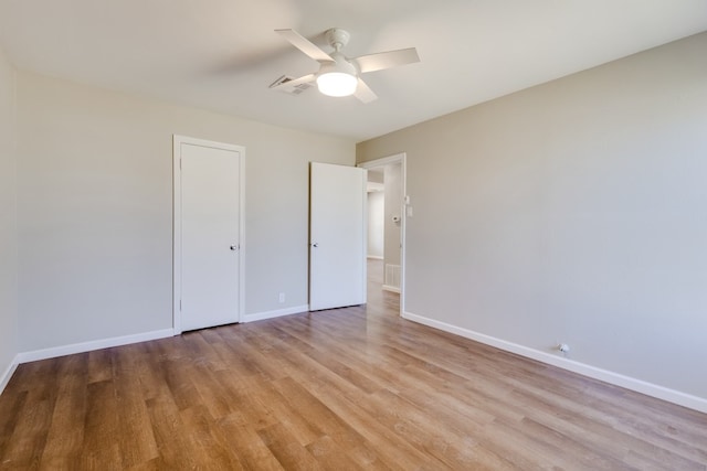 unfurnished bedroom featuring light hardwood / wood-style flooring and ceiling fan