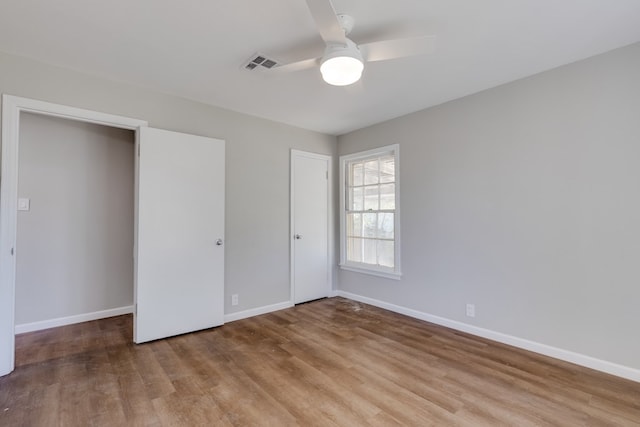 unfurnished bedroom with light hardwood / wood-style flooring and ceiling fan