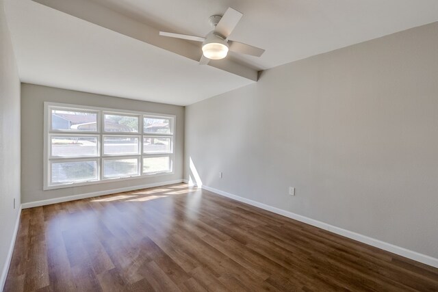 unfurnished room featuring ceiling fan and dark hardwood / wood-style floors