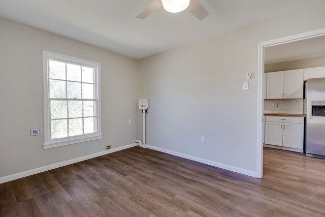 spare room featuring ceiling fan and light hardwood / wood-style floors