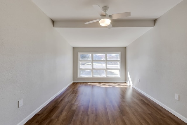 empty room with ceiling fan and dark wood-type flooring