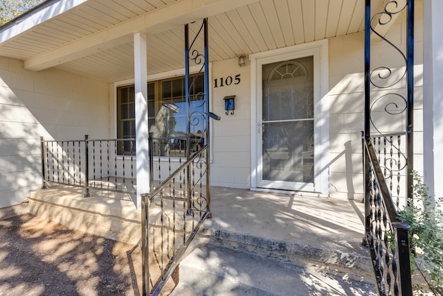 doorway to property featuring a porch