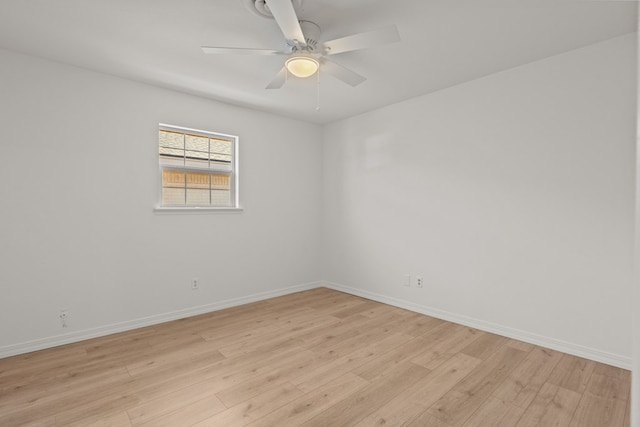 spare room featuring ceiling fan and light hardwood / wood-style flooring