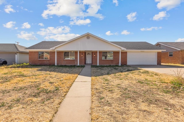 ranch-style house featuring a front lawn and a garage