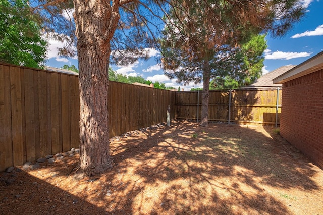 1608 Castleford Rd, Midland, TX 79705 - view of yard with a fenced backyard