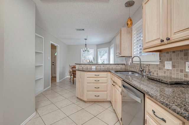 1608 Castleford Rd, Midland, TX 79705 - kitchen with a sink, decorative backsplash, dishwasher, and light brown cabinets