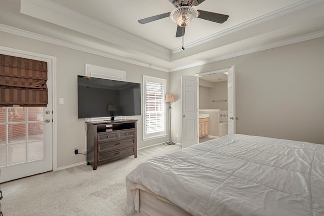 1608 Castleford Rd, Midland, TX 79705 - carpeted bedroom featuring ornamental molding, baseboards, a tray ceiling, a ceiling fan, and ensuite bath