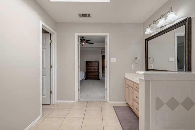1608 Castleford Rd, Midland, TX 79705 - bathroom with ceiling fan, visible vents, tile patterned flooring, vanity, and baseboards