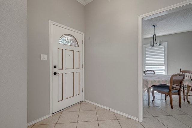 1608 Castleford Rd, Midland, TX 79705 - foyer entrance featuring baseboards, ornamental molding, and light tile patterned floors