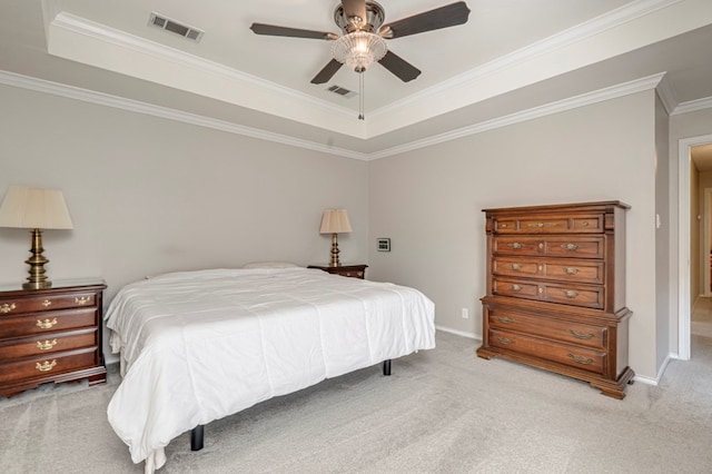 1608 Castleford Rd, Midland, TX 79705 - bedroom featuring visible vents, crown molding, a tray ceiling, and light colored carpet
