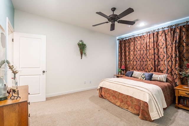 bedroom featuring visible vents, baseboards, carpet, and a ceiling fan