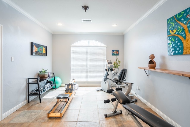 exercise room with visible vents, crown molding, and baseboards