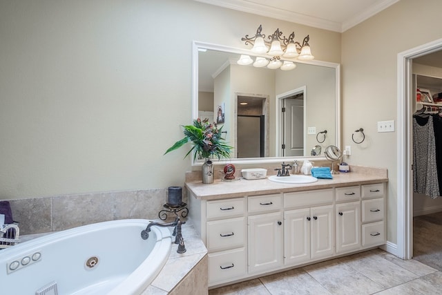 bathroom with a jetted tub, a walk in closet, ornamental molding, tile patterned floors, and vanity