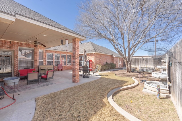 view of yard with ceiling fan, a patio, and a fenced backyard