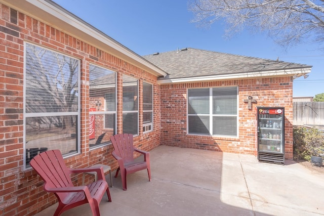 view of patio featuring fence