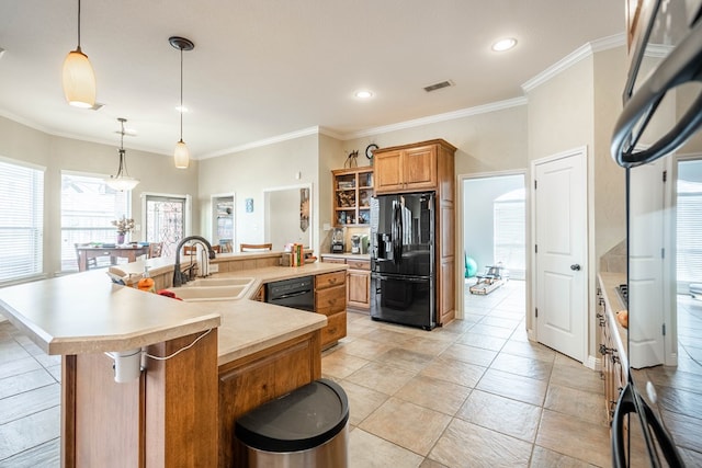 kitchen with visible vents, black appliances, a sink, a spacious island, and light countertops