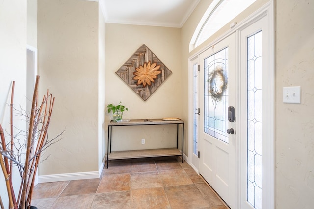 foyer with crown molding and baseboards