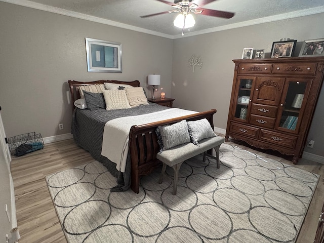 3212 Fannin Ave, Midland, TX 79705 - bedroom with light wood-style floors, crown molding, and ceiling fan
