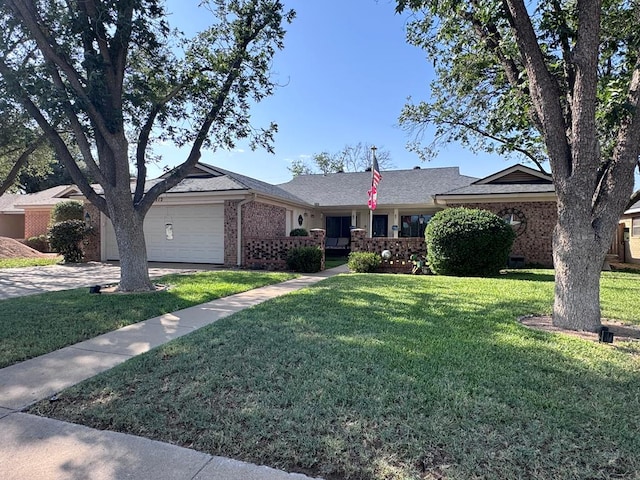 3212 Fannin Ave, Midland, TX 79705 - single story home featuring brick siding, a garage, a front yard, and driveway