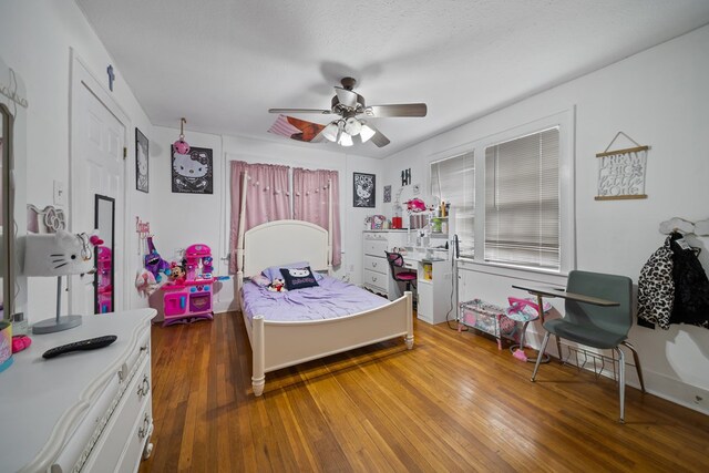 407 Edwards Blvd, Big Spring, TX 79720 - bedroom with wood finished floors and ceiling fan