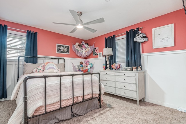 4100 Skyline Dr, Midland, TX 79707 - bedroom with carpet, a wainscoted wall, and ceiling fan