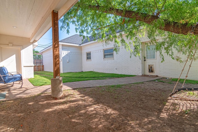 4100 Skyline Dr, Midland, TX 79707 - view of green lawn featuring a patio area