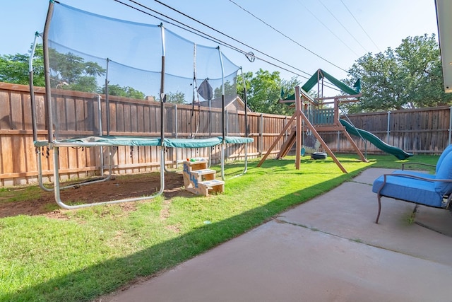 4100 Skyline Dr, Midland, TX 79707 - fenced backyard with a trampoline, a patio, and a playground