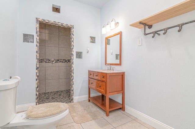 4100 Skyline Dr, Midland, TX 79707 - bathroom featuring tiled shower, vanity, and tile patterned flooring