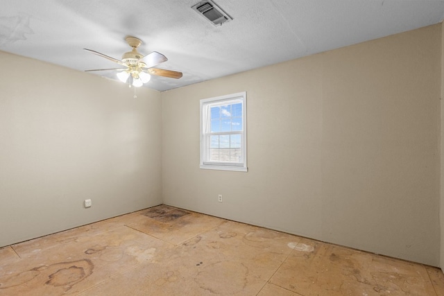 spare room with ceiling fan