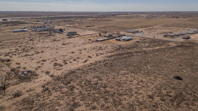 birds eye view of property with a rural view