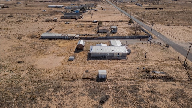 birds eye view of property with a rural view