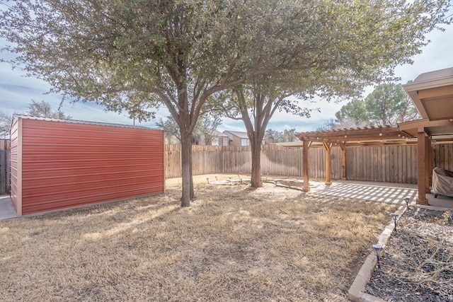 view of yard featuring a fenced backyard, a pergola, and a patio