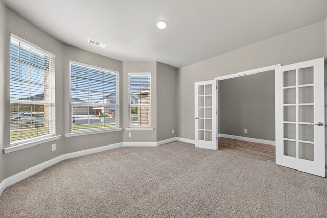 1803 Overshine Ln, Midland, TX 79705 - carpeted spare room with french doors and baseboards