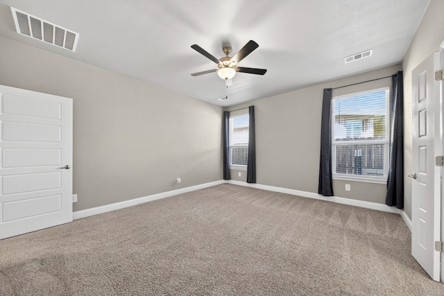 1803 Overshine Ln, Midland, TX 79705 - carpeted spare room with ceiling fan and baseboards