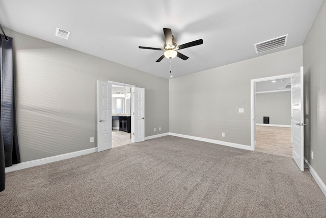 1803 Overshine Ln, Midland, TX 79705 - unfurnished bedroom featuring carpet, a ceiling fan, and ensuite bath