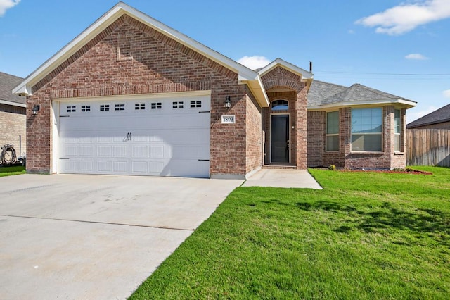 1803 Overshine Ln, Midland, TX 79705 - view of front of house featuring brick siding, concrete driveway, and an attached garage