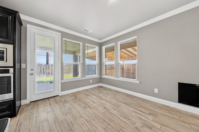 1803 Overshine Ln, Midland, TX 79705 - unfurnished sunroom with wood finished floors and crown molding