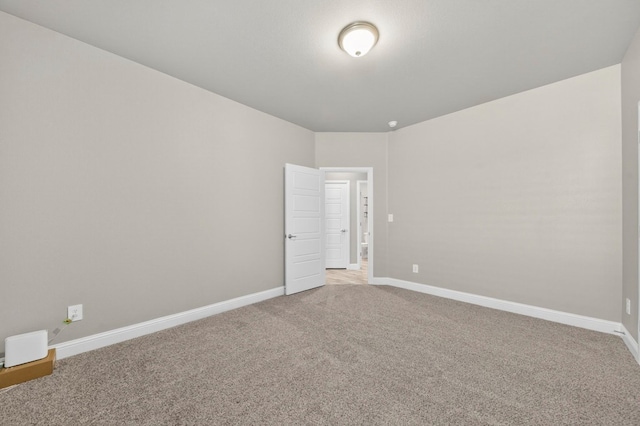 1803 Overshine Ln, Midland, TX 79705 - spare room featuring light colored carpet and baseboards