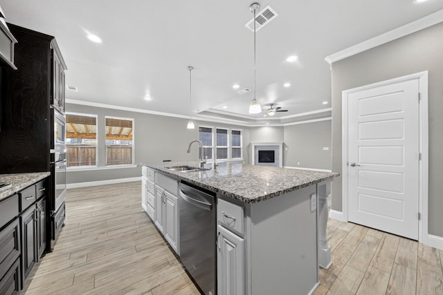 1803 Overshine Ln, Midland, TX 79705 - kitchen with stainless steel appliances, ornamental molding, ceiling fan, light wood-style flooring, and recessed lighting