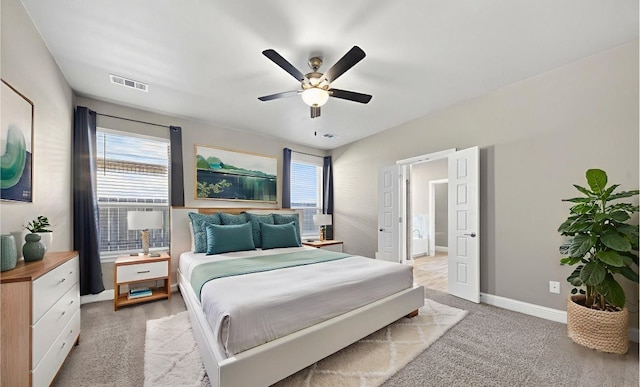 1803 Overshine Ln, Midland, TX 79705 - bedroom featuring multiple windows, light colored carpet, and a ceiling fan