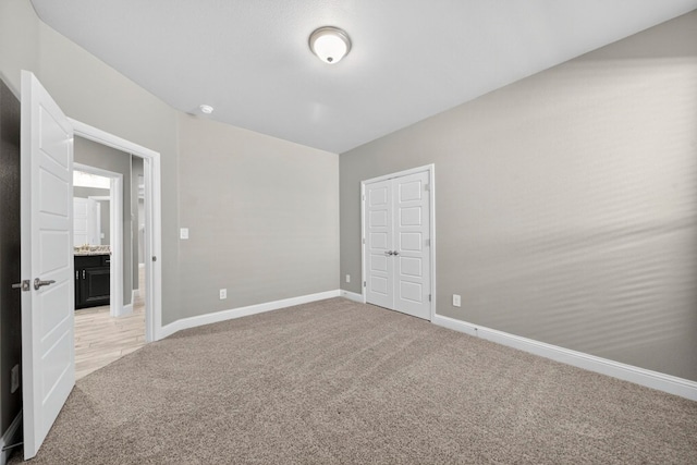 1803 Overshine Ln, Midland, TX 79705 - empty room featuring light carpet and baseboards