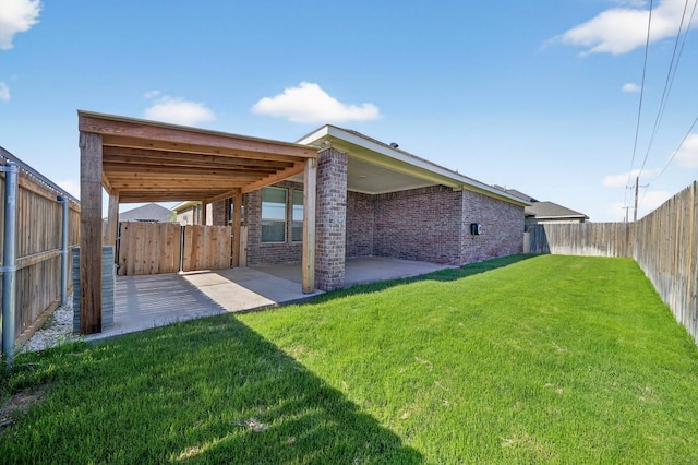 1803 Overshine Ln, Midland, TX 79705 - rear view of house with a patio area, brick siding, and a fenced backyard
