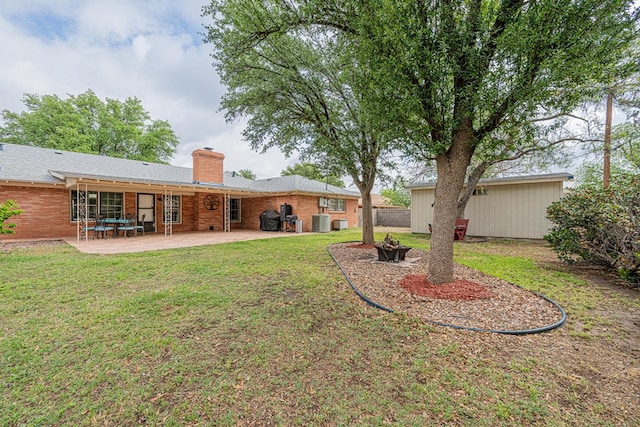 view of yard featuring a patio and cooling unit