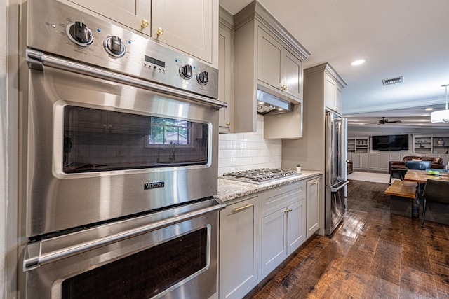 kitchen featuring gray cabinets, stainless steel appliances, open floor plan, dark wood-type flooring, and visible vents