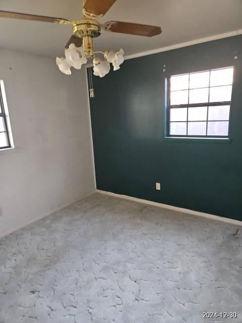 unfurnished room featuring ornamental molding